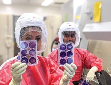 Pitt students working in the coronavirus lab.