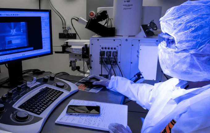 scientist looking at a computer screen