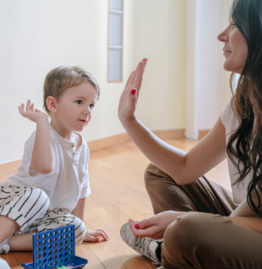 mom high fiving her child
